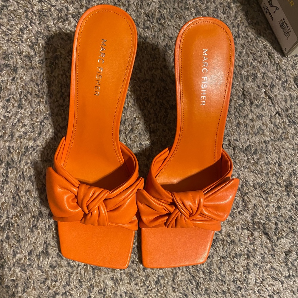 Women Size 10 orange high heel slides.